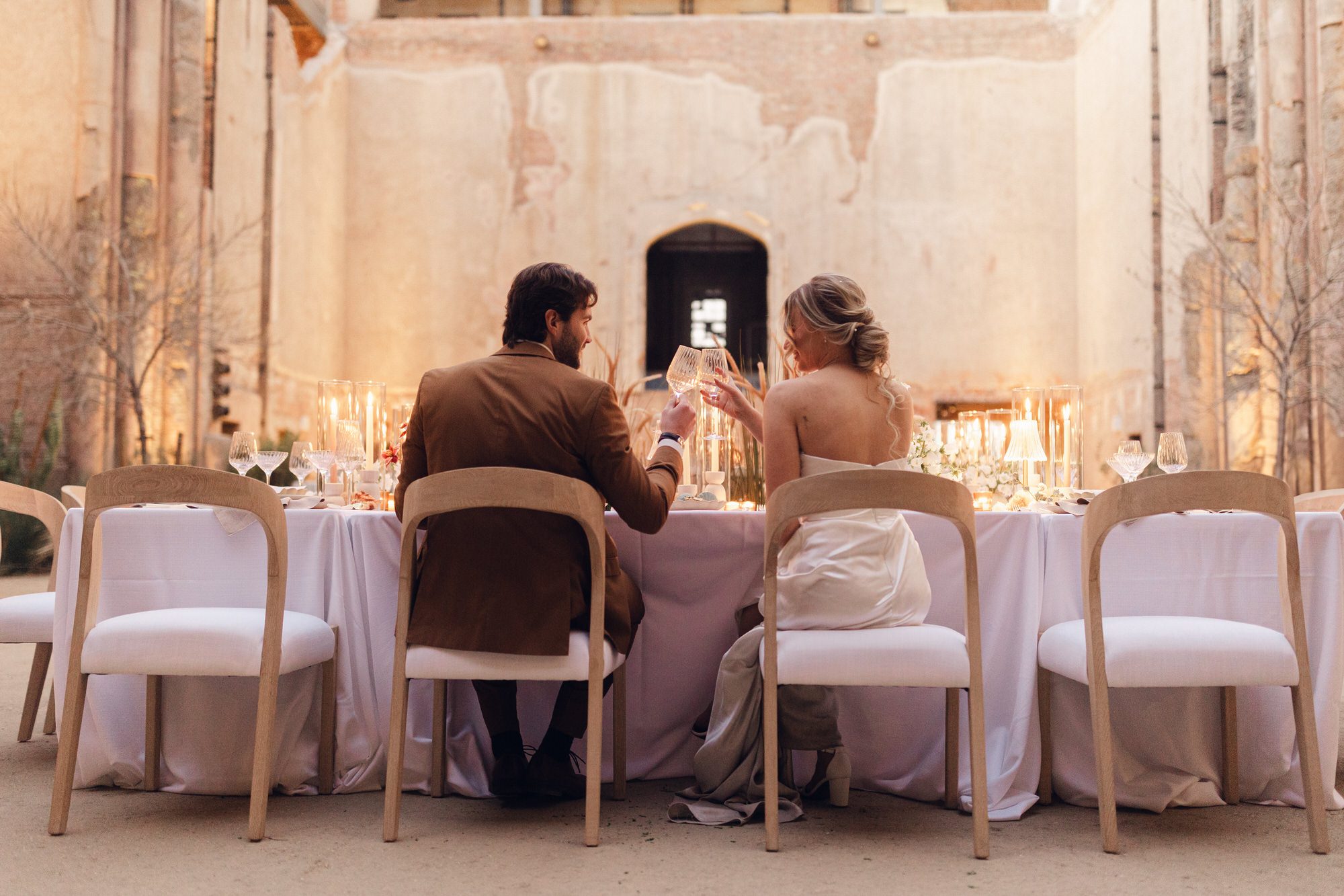 Couple toasts each other at Phoenix Arizona wedding at the Abbey on Monroe.